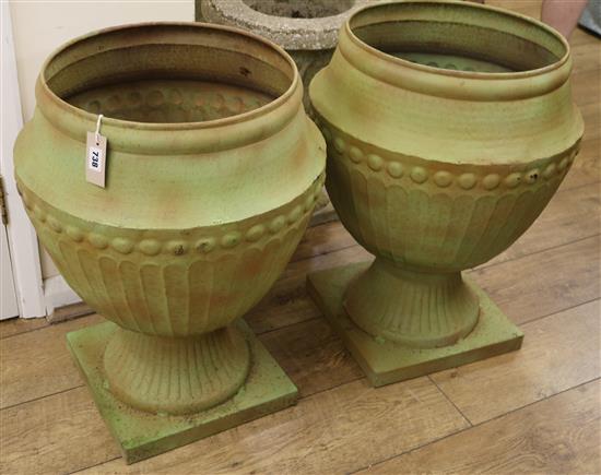 A pair of metal urns, H.63cm
